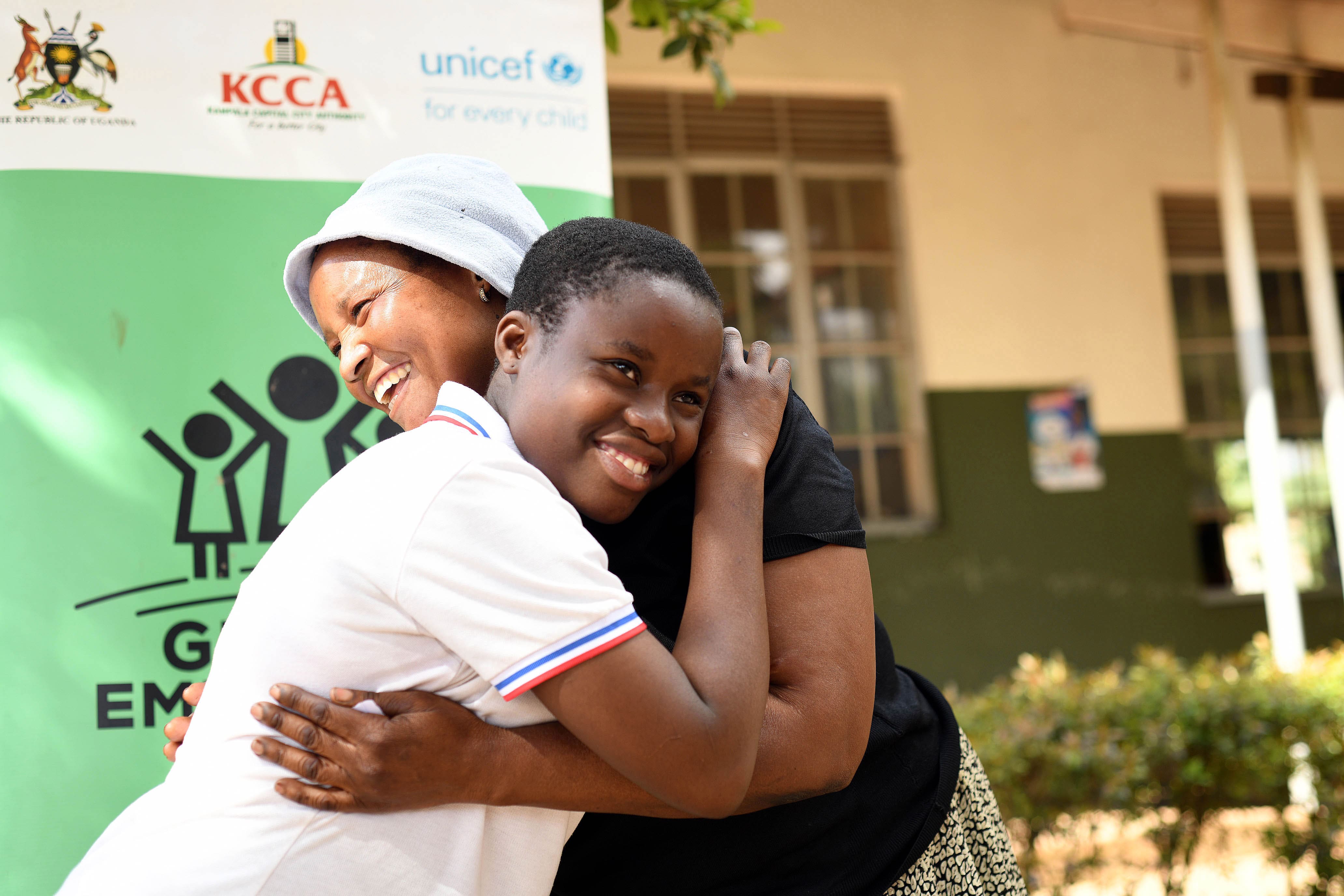 Nakato Faswiha 14 years hugs her mother Nakayaga Kadija after being registered for the Social Protection programme. Nakayaga said she is happy because her daughter is going to get skills that will help her to work and get money in future. This was at Katwe Primary School in Katwe Parish in Makindye Division in Kampala City on August 22, 2022. The four year progamme targeting in and out of school adolescent girls in Kampala District is a partnership between UNICEF and the Government of Belgium. 