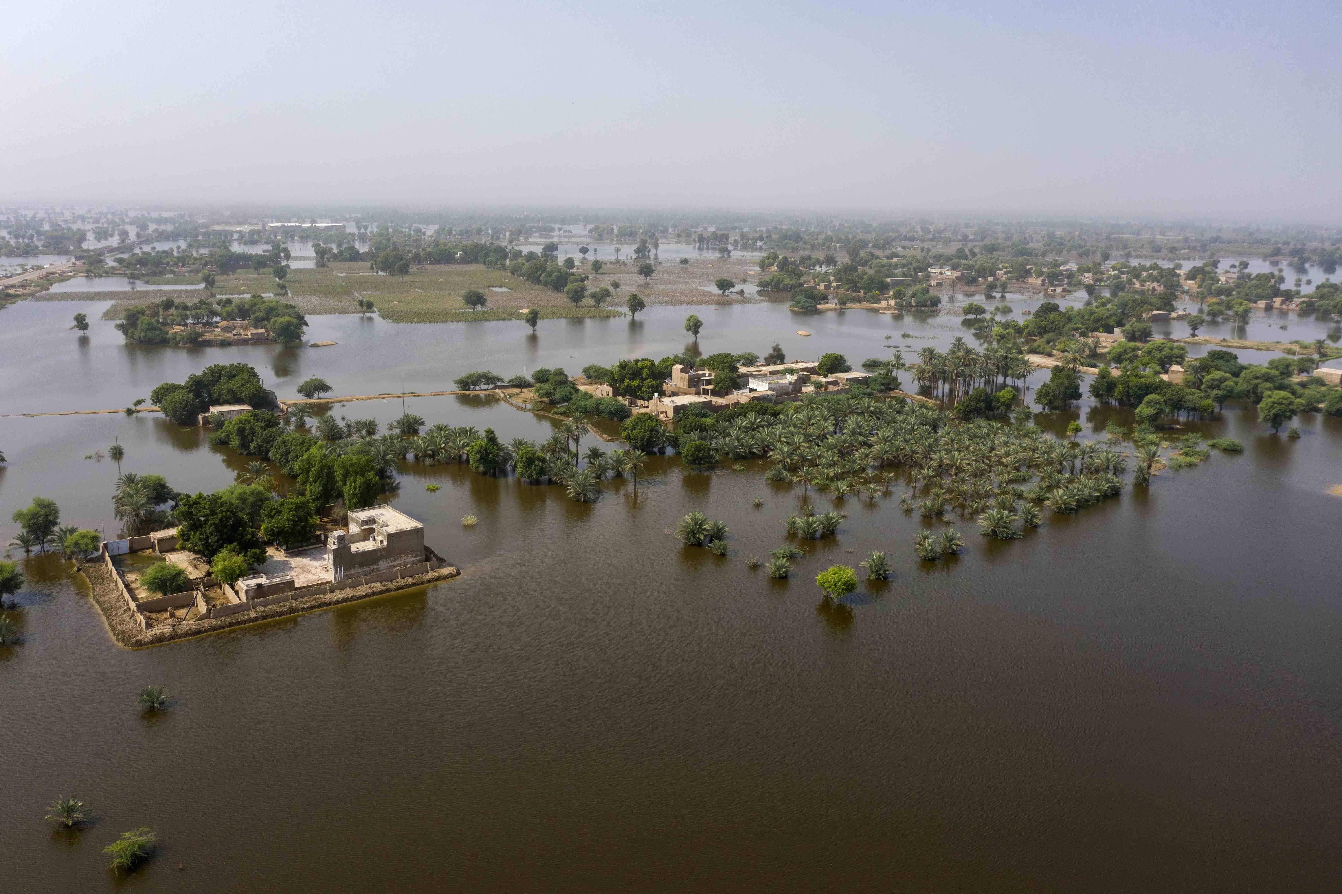 On 12 September 2022, an aerial view of flood-affected Din Xux Malah village in Khairpur district, Sindh Province, Pakistan.Ongoing torrential monsoon rains and the subsequent floods have washed away villages and infrastructure in all four provinces of Pakistan, killing more than 1,000 people, a third of them children, since June 2022. The government of Pakistan says at least 33 million people have been affected by this climate disaster, which has plunged already vulnerable populations into further distress