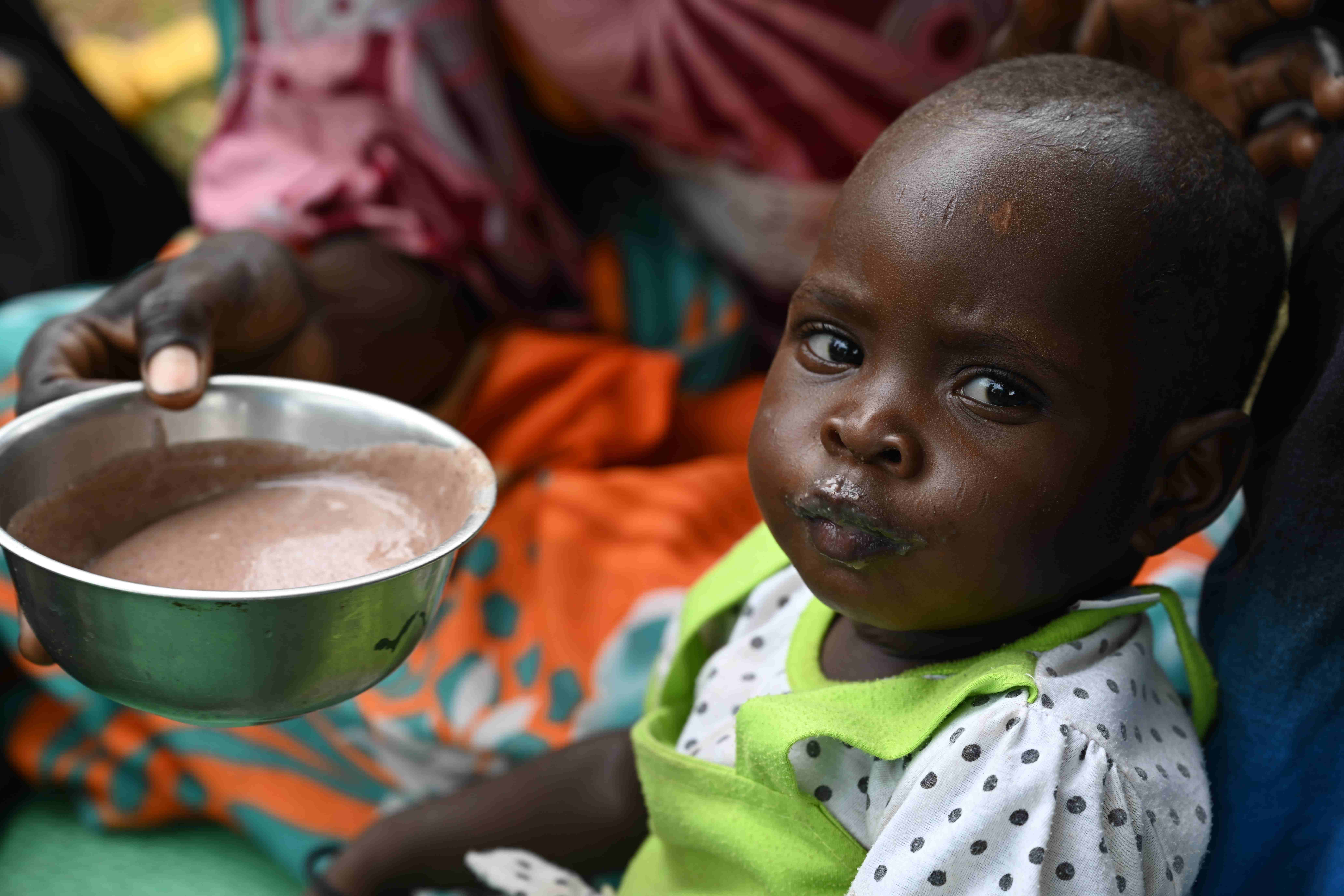 Children eat a nutritious meal, in the village of Golonti, in the Guéra Region of Chad.
