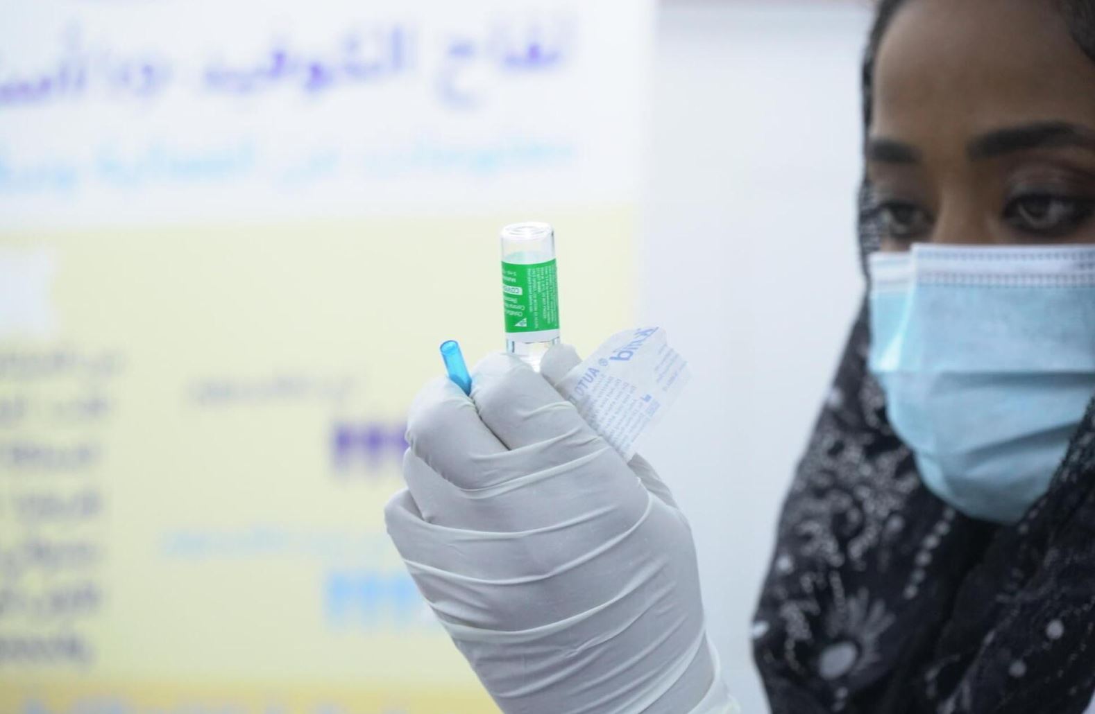 Image of a frontline worker with a vaccine 
